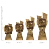 Cycling Antique Gold Lynx trophies next to ruler