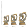 Football Gravity trophies next to ruler Football Gravity trophies next to ruler