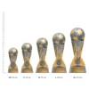 Football Mercury trophies next to ruler Football Mercury trophies next to ruler