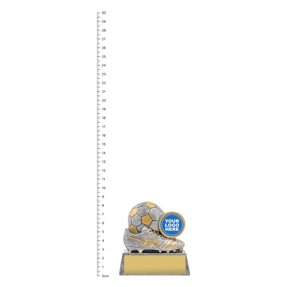 Football Squad trophy next to ruler Football Squad trophy next to ruler
