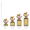 Gym Marble Gym Marble trophies next to ruler
