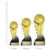 Pegasus gold trophies next to ruler