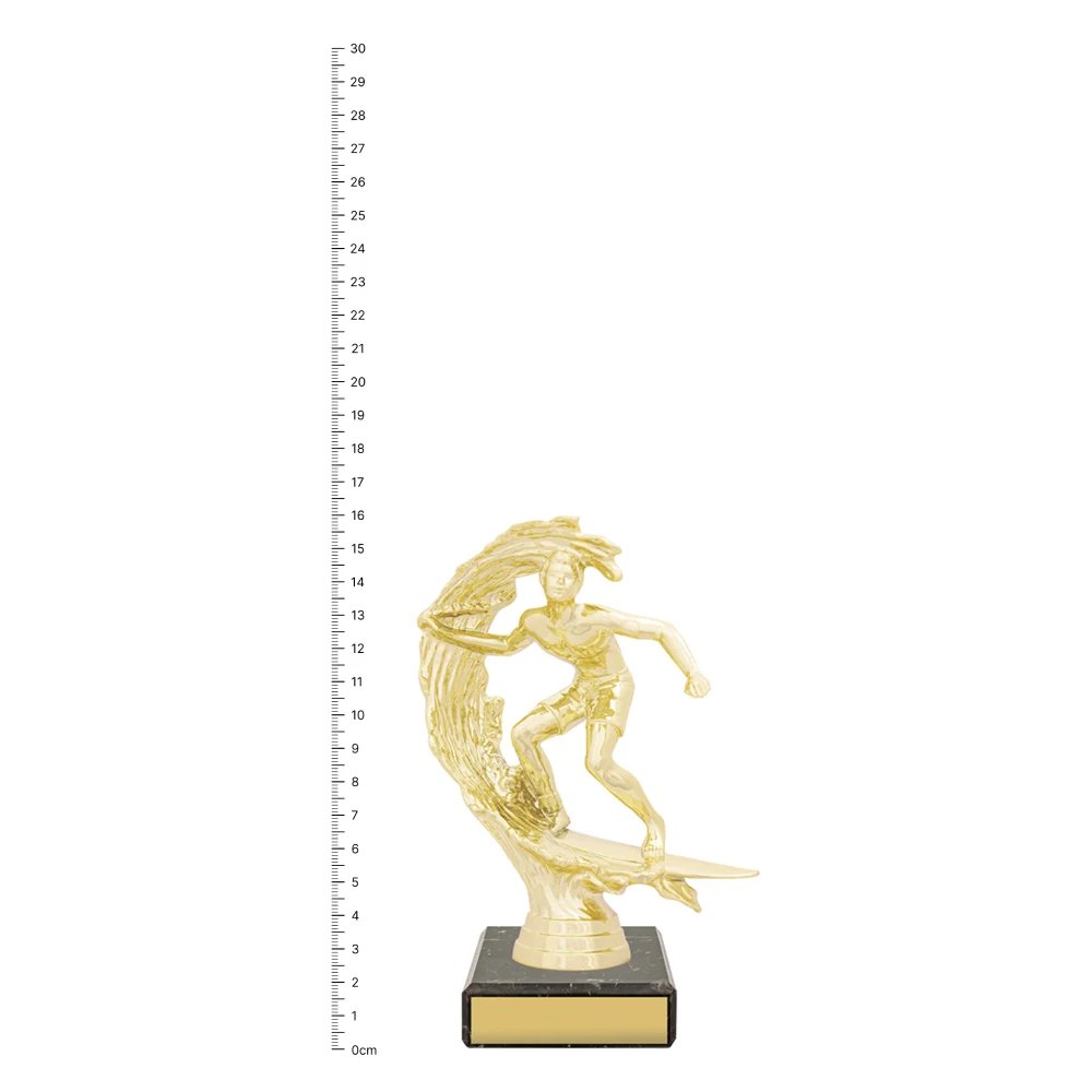 Surfing Figure Trophy next to ruler Surfing Figure Trophy next to ruler