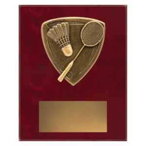 cross country plaque with racket and shuttlecock and emblem on a wooden plaque.