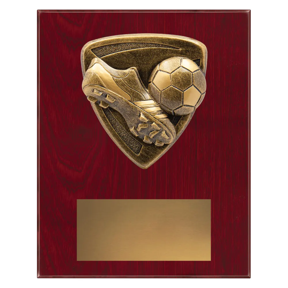 football plaque with boot, ball and goal emblem on a wooden plaque.